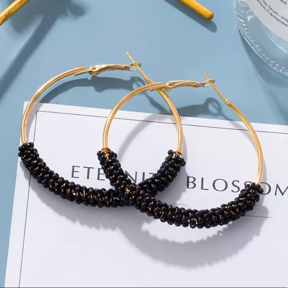 Gold and black hoop earrings